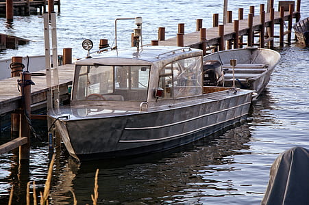 Product Photography of Silver Motor Boat Neck Dock during Daytime thumbnail