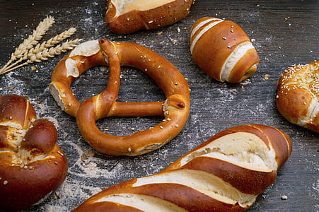 pretzels and breads on brown pad thumbnail