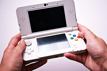 Person Holding Nintendo Ds thumbnail