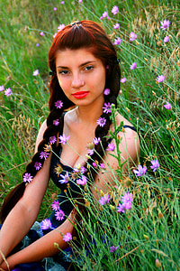 woman sitting on green grass field thumbnail