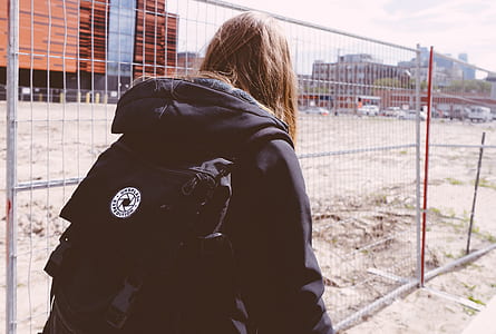 person in black hoodie and backpack thumbnail