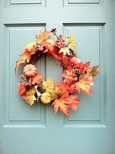 yellow autumn wreath hanged on door thumbnail