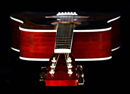 Close Up Photography of Red Wooden Guitar Head Stock thumbnail