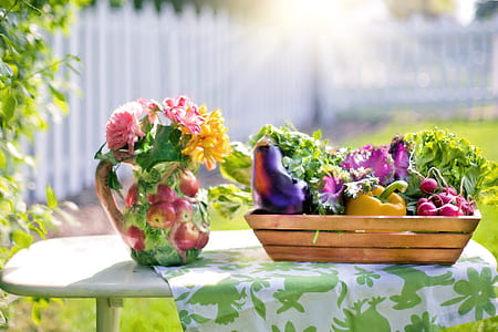 petaled on vase beside vegetables on the basket thumbnail