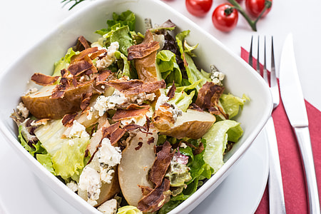 potato salad dish in white bowl near table thumbnail