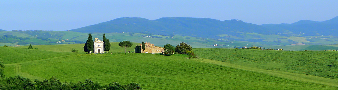 photo of green grass near brown house thumbnail