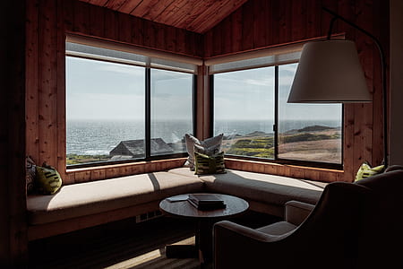 round brown wooden table and sofa thumbnail