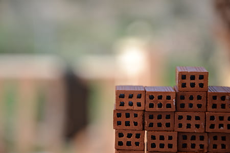 brown cinder block lot in bokeh photography thumbnail