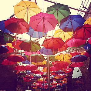 umbrella decor on alley thumbnail