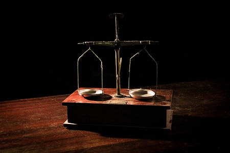 brown balance scale on brown wooden box thumbnail
