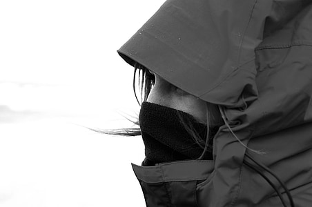 woman in hoodie and balaclava greyscale photography thumbnail