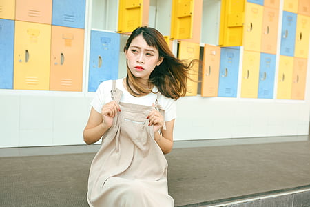 woman in brown and white dress thumbnail