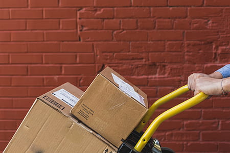 Shipping Boxes On Trolly Close Up Photo thumbnail