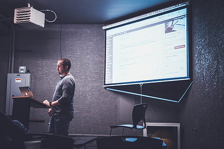 man in front of laptop computer thumbnail