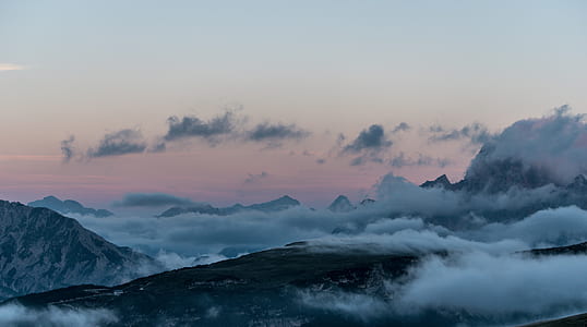 bird's-eye view of mountain covered with fog thumbnail