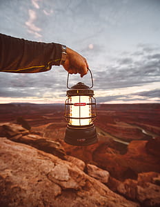 person holding lantern thumbnail