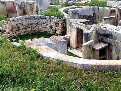 brown concrete ruins beside grass field thumbnail