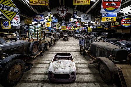 white vehicle surrounded with classic cars thumbnail