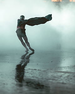 man wearing black cape fronting fog thumbnail