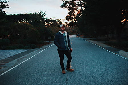 man wearing gray full-zip jacket standing on street thumbnail