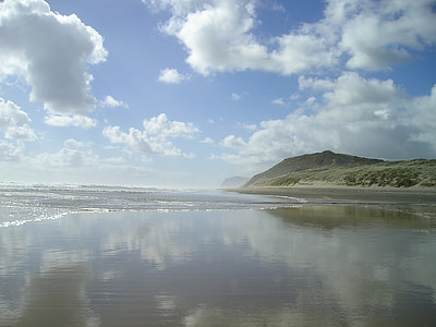 calm body of water near cliff thumbnail