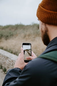 Man Taking Photo of Person Walking thumbnail