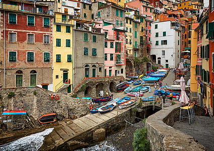 assorted-color boat lot near body of water thumbnail