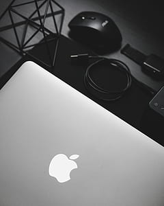 white MacBook beside black USB cable thumbnail