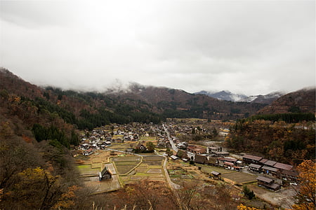 village surrounded by mountain and trees thumbnail