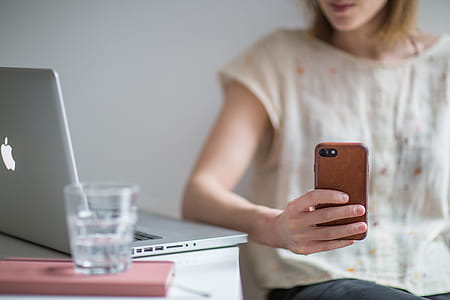 Photo of Woman Holding Smartphone thumbnail
