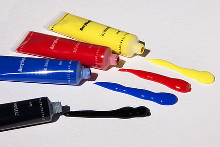four yellow, red, blue, and black color labeled soft tube bottles thumbnail