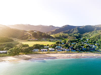 view of houses near seashores and mountains thumbnail
