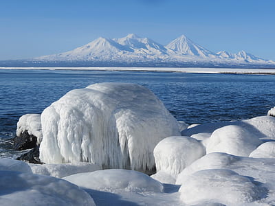mountain and body of water during winter thumbnail