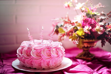 pink icing covered cake on white plate thumbnail