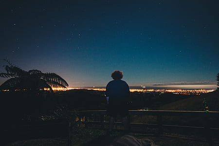man standing near fence thumbnail