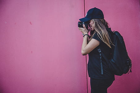 woman holding camera thumbnail