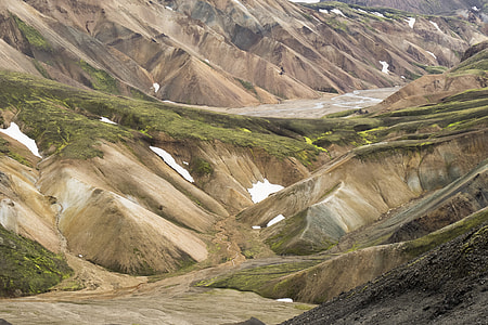 photo of brown hills with green grass at daytime thumbnail