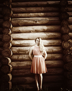 woman standing on tree log wall thumbnail