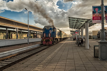 blue and red train at station during daytime thumbnail