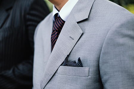 man wearing gray notched lapel suit jacket thumbnail
