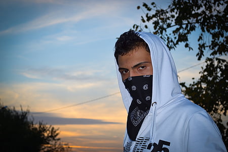 man wearing white hoodie and black handkerchief thumbnail