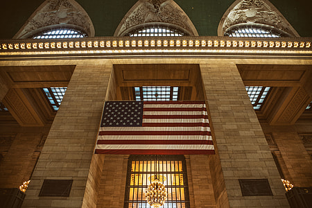 Interior shot containing USA flag taken at Grand Central Station in Manhattan, New York City thumbnail