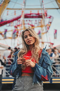 Young Woman Posing At Carnival Photo thumbnail