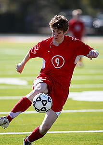 soccer player kicking ball thumbnail