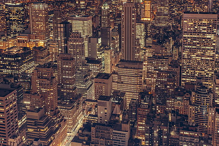 aerial photograph of city skyscrapers at night thumbnail