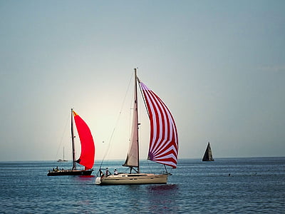three sailing ships under gray sky thumbnail