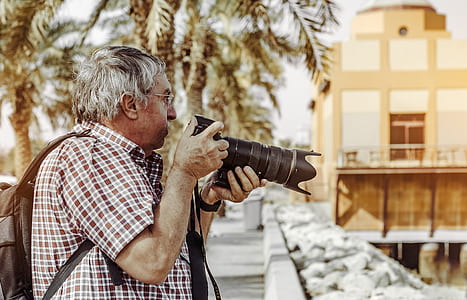 Man Holding Dslr Camera thumbnail