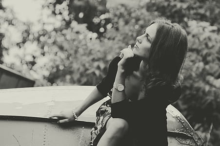 grayscale photo of woman in elbow-sleeved dress thumbnail