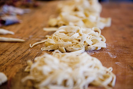 pasta on brown surface in focus photogprahy thumbnail