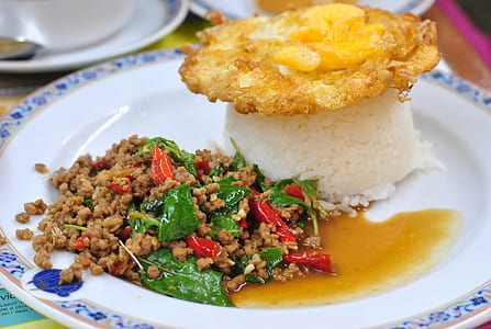 fried egg on top of white rice thumbnail